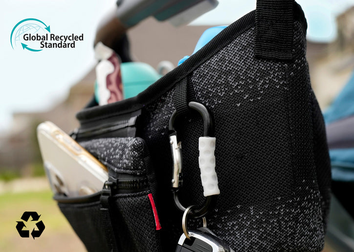 Nuby’s Eco Stroller Organizer full of supplies. The Global Recycled Standard logo appears in the top-left corner. The recycling symbol is at the bottom left.