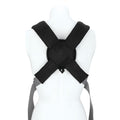 A mannequin torso displays the Nuby Classic Baby Carrier in black, featuring crossed straps, breathable mesh, and gray adjustable belts, shown from the back against a white background.