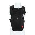 The Nuby Classic Baby Carrier in black is shown on a white mannequin. Featuring padded shoulder straps, breathable mesh front, adjustable buckles, and a red tag, it’s designed for newborns to toddlers.