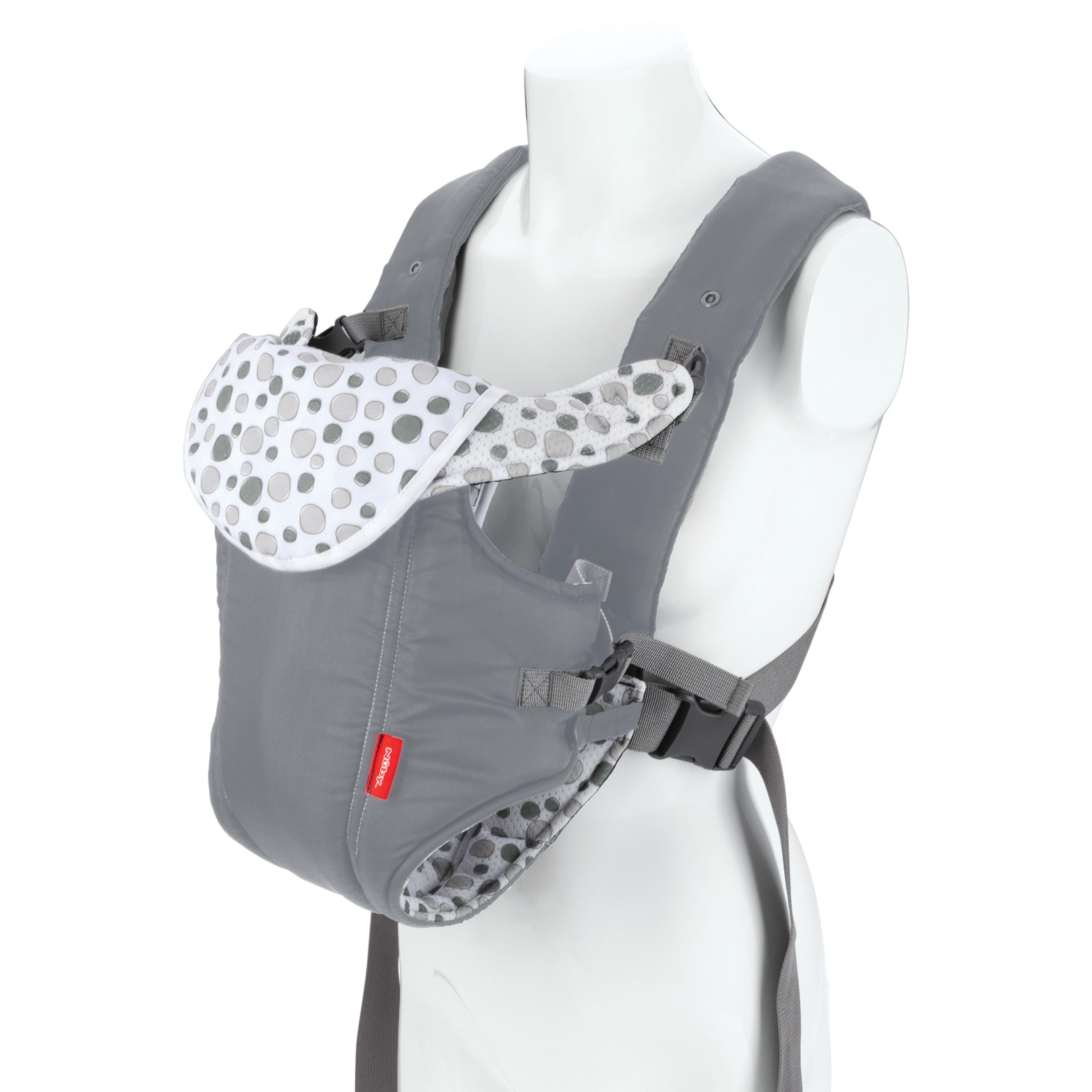 The Nuby Classic Baby Carrier | Grey features breathable mesh, padded shoulder straps, and a polka dot flap. Suitable from newborn to toddler, it's shown on a white mannequin torso.
