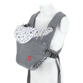 The Nuby Classic Baby Carrier | Grey features breathable mesh, padded shoulder straps, and a polka dot flap. Suitable from newborn to toddler, it's shown on a white mannequin torso.