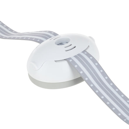 A close-up of Soft Sounds Baby Earmuffs | White, featuring a white plastic device with a gray base and an adjustable headband with a gray ribbon adorned with white polka dots and stripes. Perfect for protecting your baby's hearing.