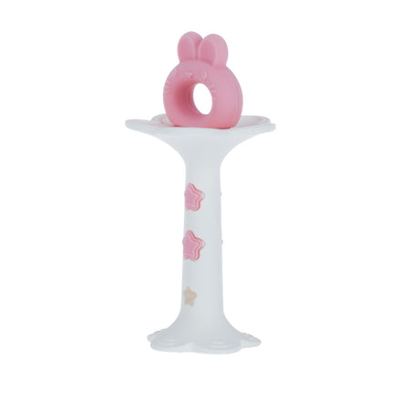 The Nuby Wand and Tuba Teether Set in Pink & Yellow features a white holder with pink and beige star accents and a ring-shaped silicone teething toy with bunny ears, offering soothing teething relief for babies.