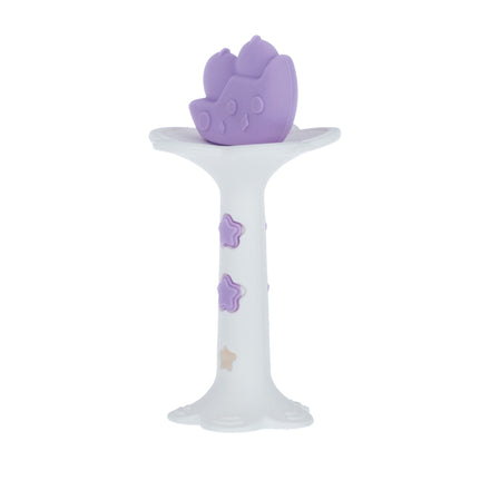The Nuby Wand and Tuba Teether Set in Purple & Pink sits atop a white pedestal with pastel stars, featuring a playful cat-shaped design that offers soothing teething relief as a charming baby toy.