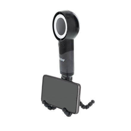 The Nuby 5-Speed Turbo Fan is a black handheld portable fan with a circular top, flexible tripod stand holding a smartphone in landscape mode, textured grip, small display screen, and USB-C rechargeable.