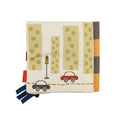 The Baby Sensory Book | City Bus features a soft fabric design with cars, a traffic light, and city buildings. Montessori-inspired, it includes side fabric tabs for tactile play, making it ideal for tummy time fun.