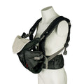 The Deluxe Baby Carrier | Black is shown on a mannequin, featuring padded and adjustable shoulder straps, a waist belt, and a white patterned cloth on the front where the baby sits.