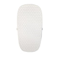 The Changing Pad is a white, rectangular pad with rounded corners and a honeycomb-textured surface. It features a non-slip base for stability and is displayed against a plain white background.
