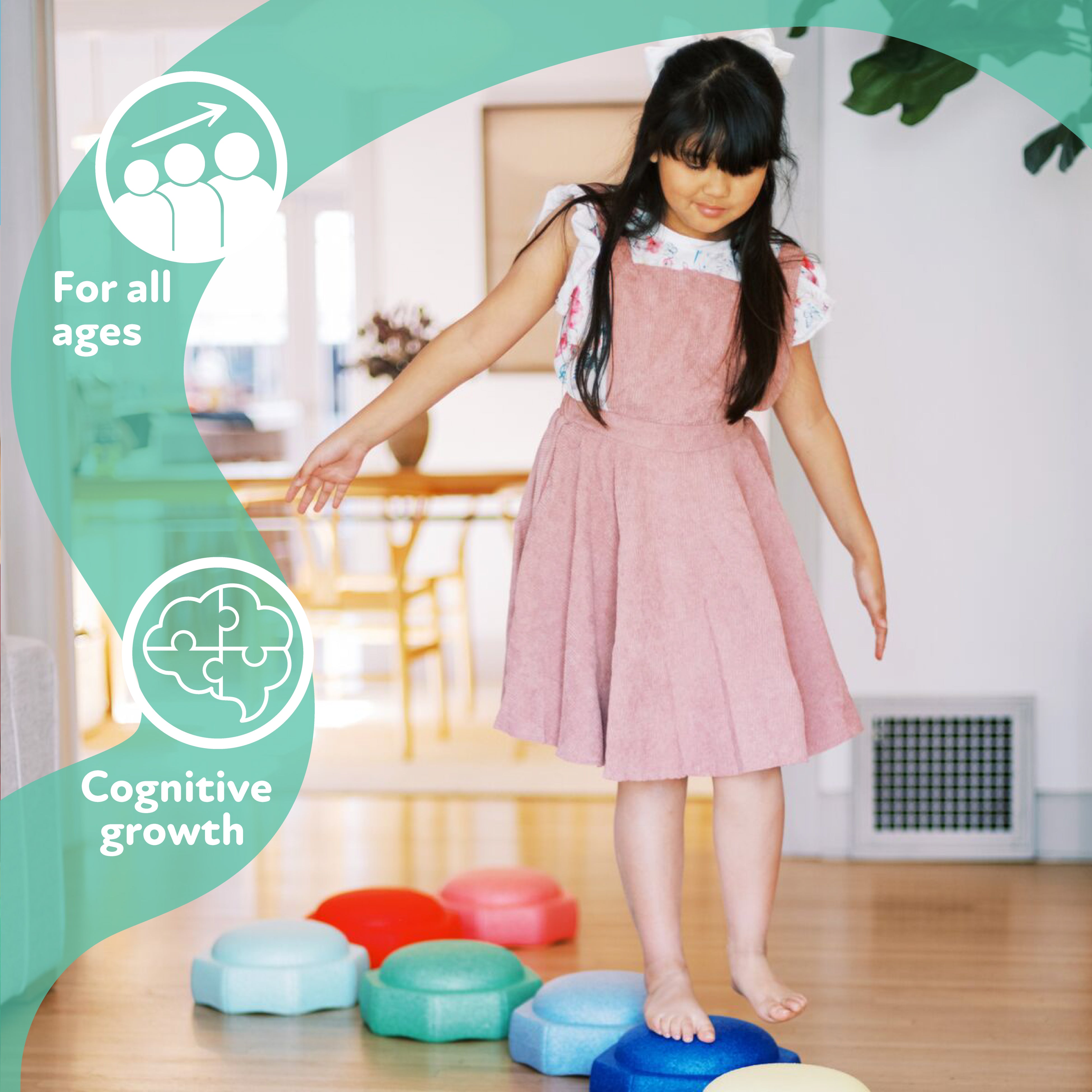 A young girl in a pink dress balances barefoot on StepPebbles and a FREE Balance Board | Pastel indoors. Icons show "For all ages" and "Cognitive growth," highlighting the learning benefits of these indoor-outdoor kids’ balance toys.