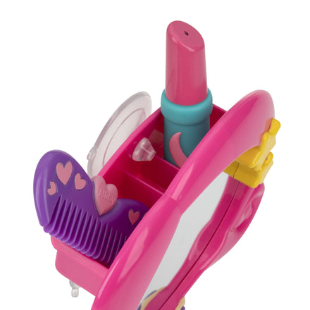 Close-up of the Nuby Mythical Mermaid Mirror Bath Set, featuring a pink vanity with built-in mirror, purple heart-accented comb, and pink pretend spray bottle in plastic compartments—ideal for encouraging self-awareness.