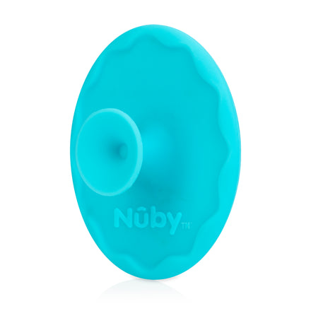 A top view of the turquoise Nuby Scrubbies Silicone Bath Brush (2 Pack) reveals its circular shape and smooth, gentle surface—ideal for little ones with sensitive skin or baby eczema.