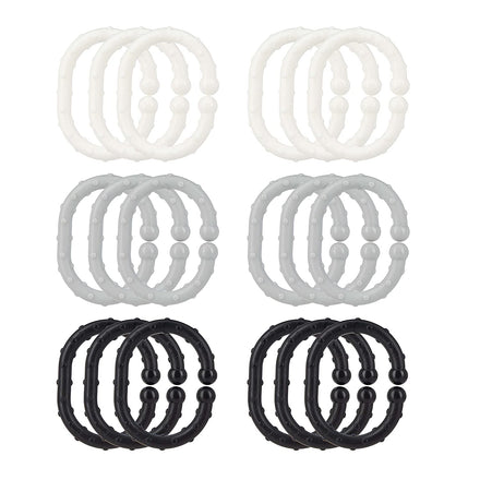The Nuby Linkables Teething Toys (18-pack) features eight pairs of round, textured rings in black, white, light grey, and medium grey. Each sensory ring has small surface bulges—perfect for babies to explore.