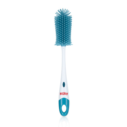 The Nuby Non-Scratch Silicone Bristle Bottle brush is blue and white, features silicone bristles, a hanging hole, integrated nipple brush, grip handle with logo, and stands upright against a white background.